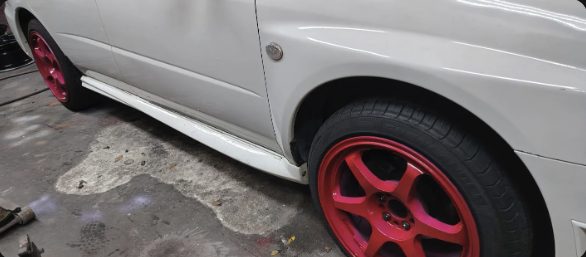 Customer's car with red sprayed rims, photo from Faadli Zaini's Google review